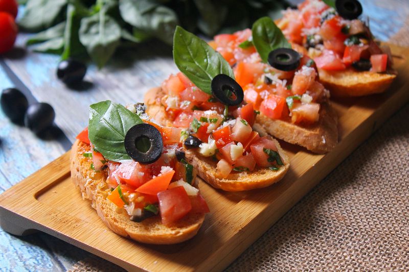 Fresh bruschetta with tomatoes and basil on toasted bread