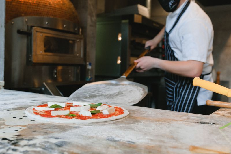 Via 313 restaurant interior with warm lighting and Detroit-style pizza